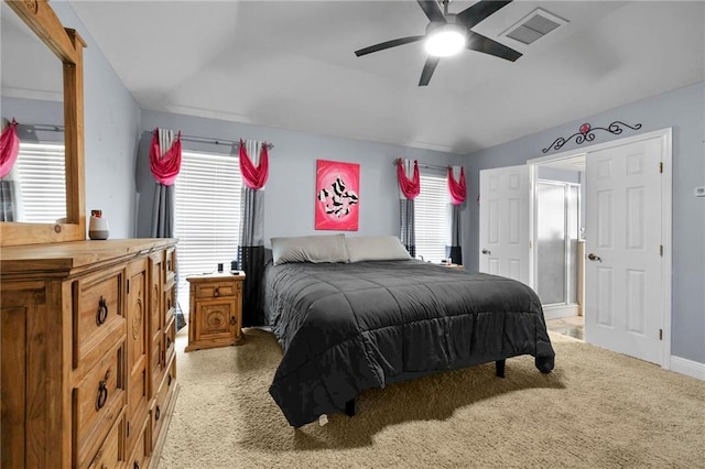 bedroom featuring ceiling fan, multiple windows, and lofted ceiling