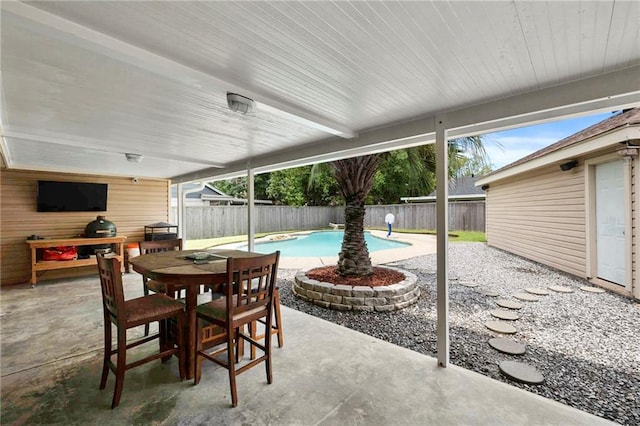 view of patio featuring a fenced in pool