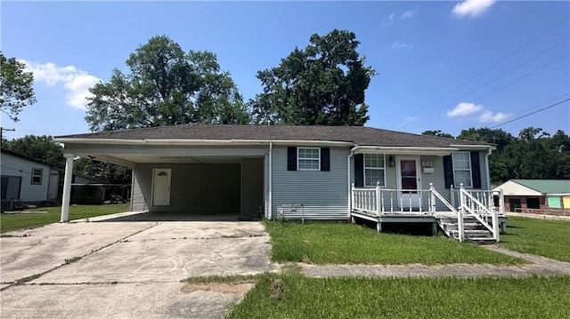 view of front of property with a carport and a front lawn