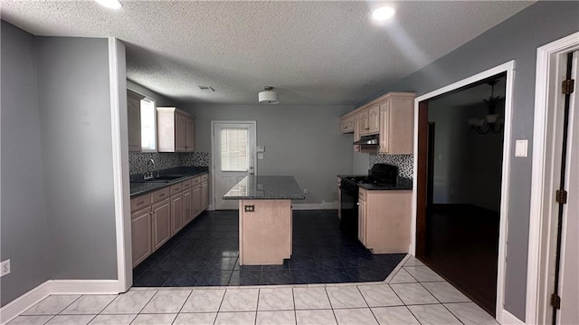 kitchen featuring tasteful backsplash, black electric range oven, sink, a kitchen island, and light tile patterned floors