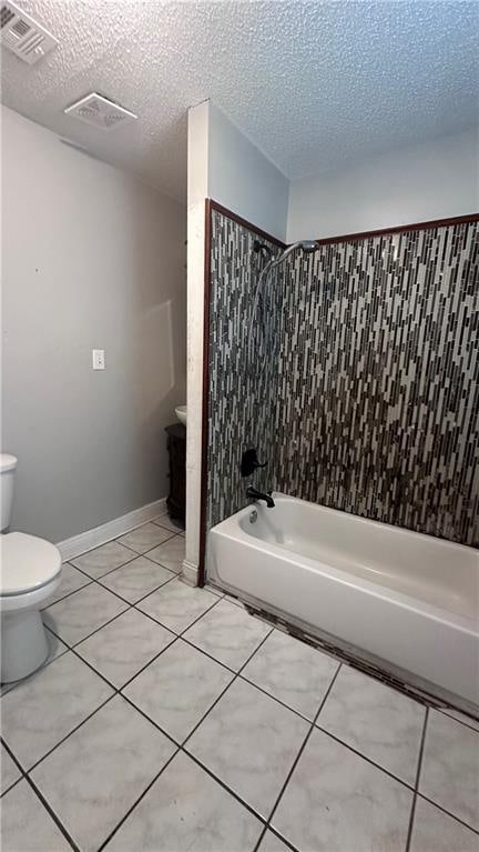 bathroom with toilet, tile patterned floors, a textured ceiling, and shower / tub combination