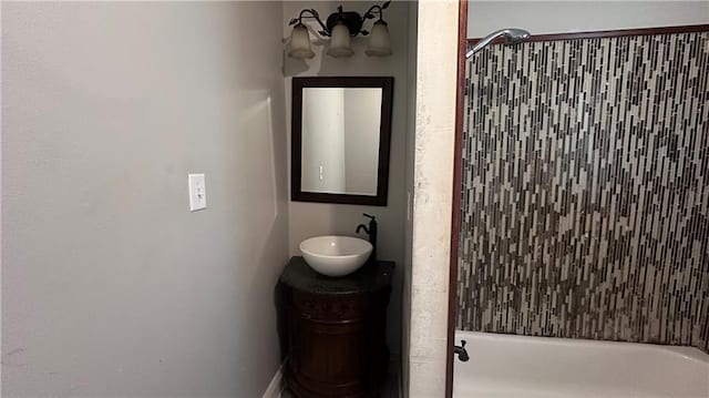 bathroom with vanity and tiled shower / bath combo