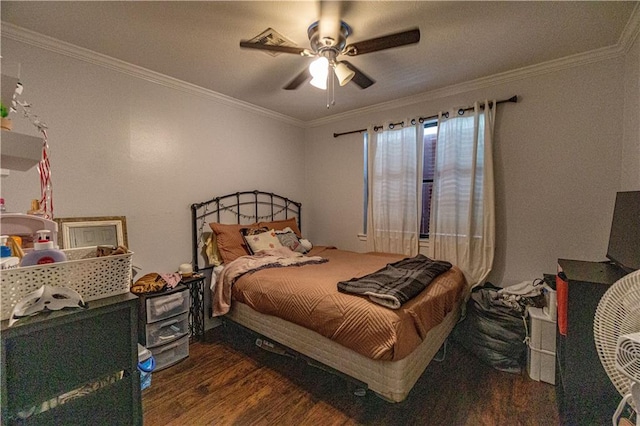 bedroom with ornamental molding, ceiling fan, and dark hardwood / wood-style floors