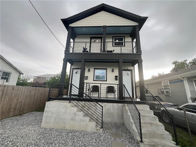 view of front facade featuring a balcony