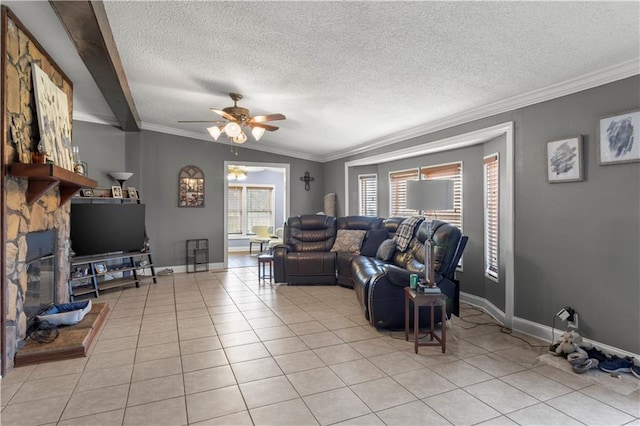 tiled living room featuring vaulted ceiling, a fireplace, ornamental molding, ceiling fan, and a textured ceiling