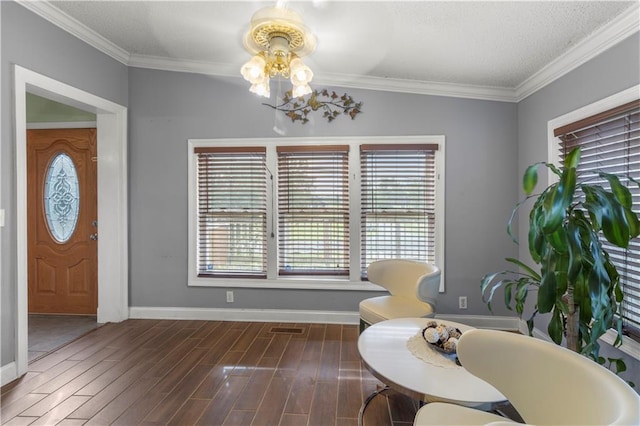 dining area featuring dark wood-type flooring and ornamental molding