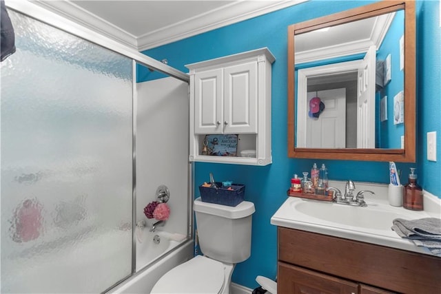 full bathroom featuring crown molding, enclosed tub / shower combo, vanity, and toilet