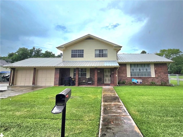 view of front of house featuring a garage, covered porch, and a front yard