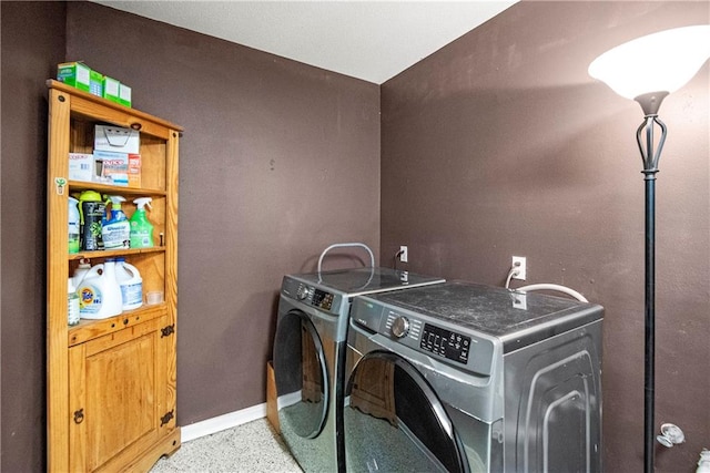 clothes washing area featuring independent washer and dryer