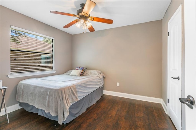 bedroom featuring ceiling fan and dark hardwood / wood-style floors