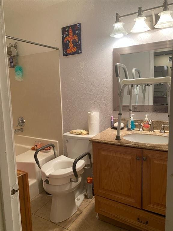 full bathroom featuring tub / shower combination, vanity, tile patterned floors, and toilet