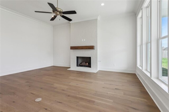 unfurnished dining area with wood-type flooring, a wealth of natural light, and a notable chandelier