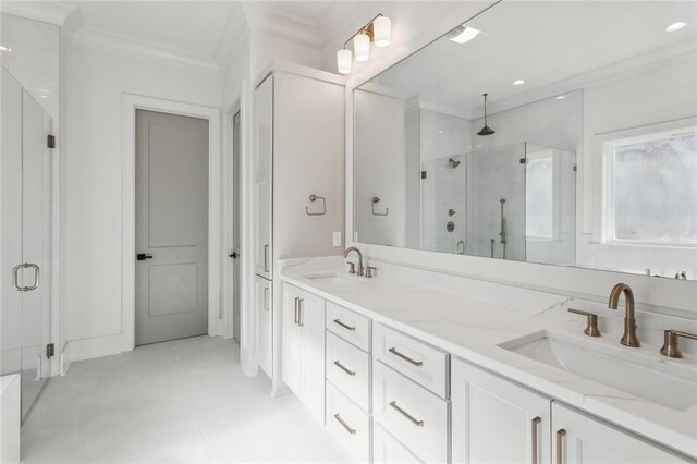 bathroom with vanity, crown molding, and separate shower and tub