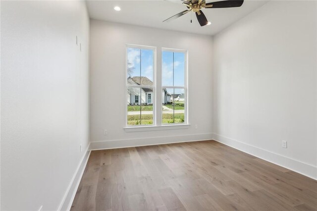 spare room with a healthy amount of sunlight and a tray ceiling