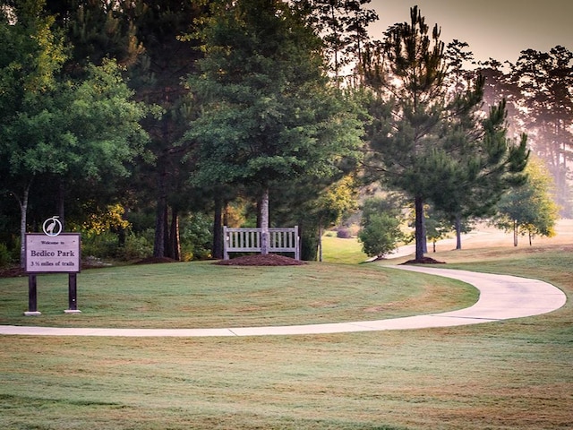 view of home's community featuring a lawn