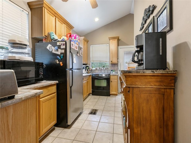 kitchen featuring lofted ceiling, light tile patterned flooring, ceiling fan, and black appliances