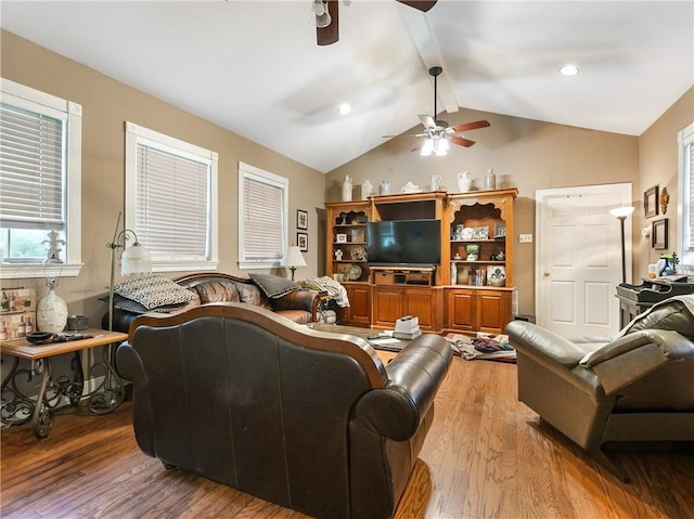 living room with vaulted ceiling with beams, ceiling fan, and wood-type flooring