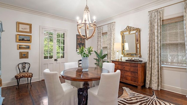 dining area with a chandelier, dark hardwood / wood-style floors, and ornamental molding