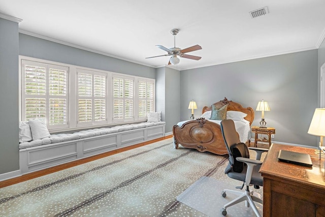 bedroom with ceiling fan, hardwood / wood-style floors, and ornamental molding