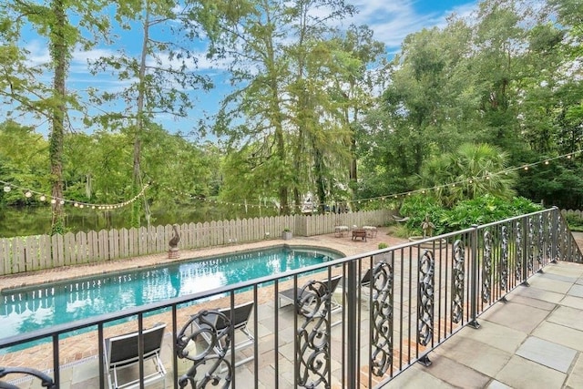 view of swimming pool featuring a patio