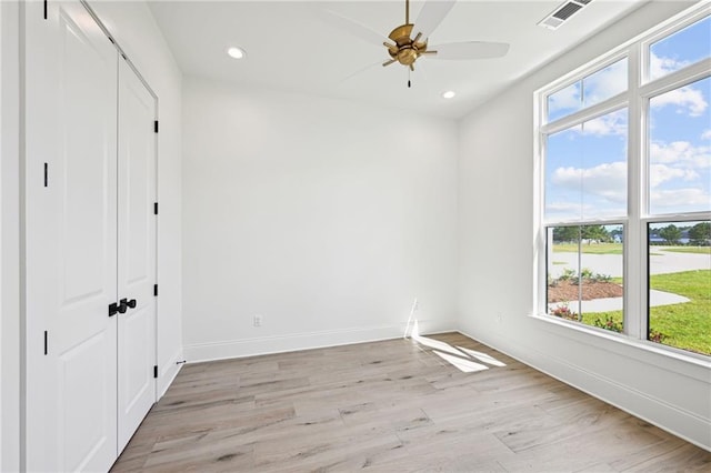 interior space featuring light wood-type flooring and ceiling fan