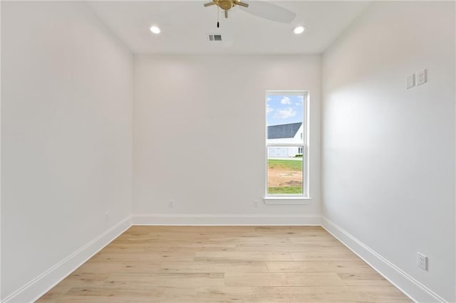 spare room with light hardwood / wood-style floors and ceiling fan