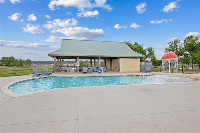 view of swimming pool featuring a patio, a gazebo, and pool water feature