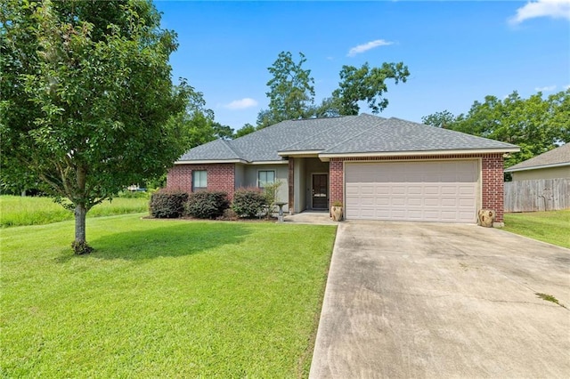 ranch-style home featuring a garage and a front yard