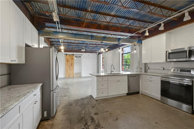 kitchen featuring white cabinetry, appliances with stainless steel finishes, sink, and light stone countertops