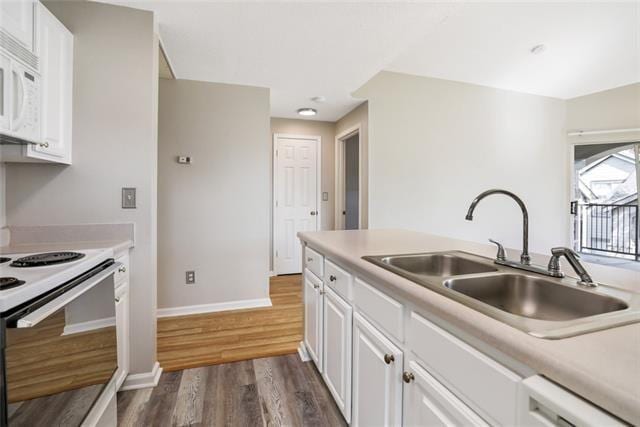 350 Emerald Forest Blvd Unit 13204, Covington, LA 70433 - kitchen with white appliances, a sink, dark wood finished floors, and white cabinetry