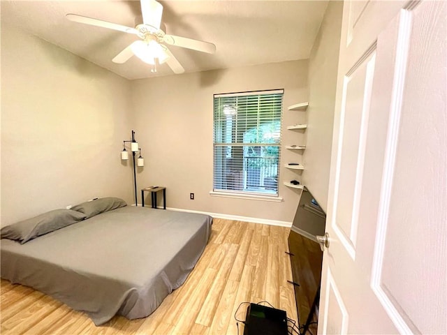 bedroom featuring light hardwood / wood-style flooring and ceiling fan