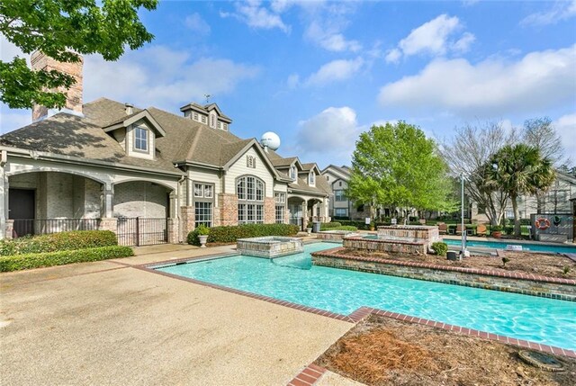 350 Emerald Forest Blvd Unit 13204, Covington, LA 70433 - view of pool with a pool with connected hot tub and a patio area