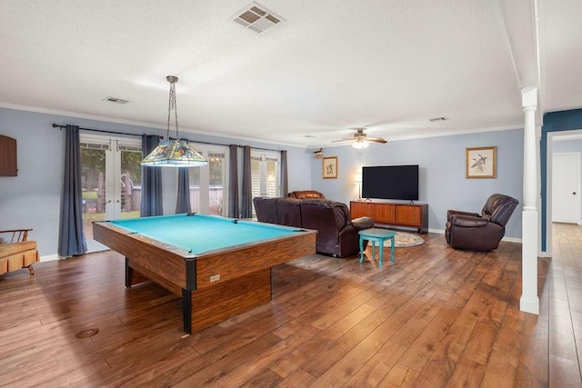 playroom featuring crown molding, wood-type flooring, french doors, and ornate columns