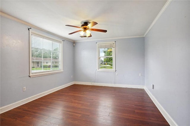 empty room with dark wood-type flooring, a healthy amount of sunlight, crown molding, and ceiling fan