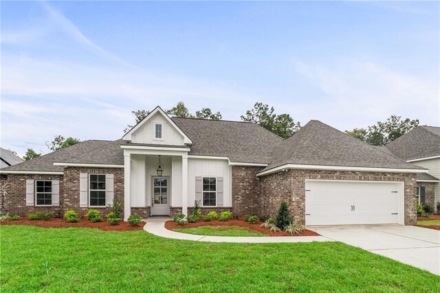 view of front of home with a garage and a front yard