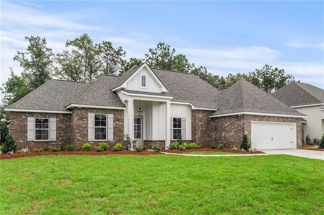 view of front of home with a garage and a front yard