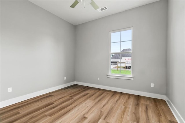 empty room with light hardwood / wood-style floors and ceiling fan