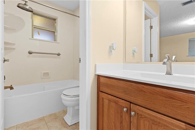 full bathroom with a textured ceiling, toilet, vanity, tile patterned floors, and bathing tub / shower combination