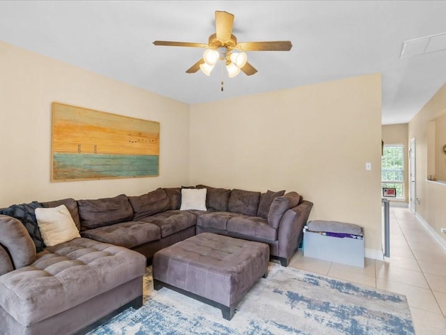 living room with light tile patterned floors and ceiling fan