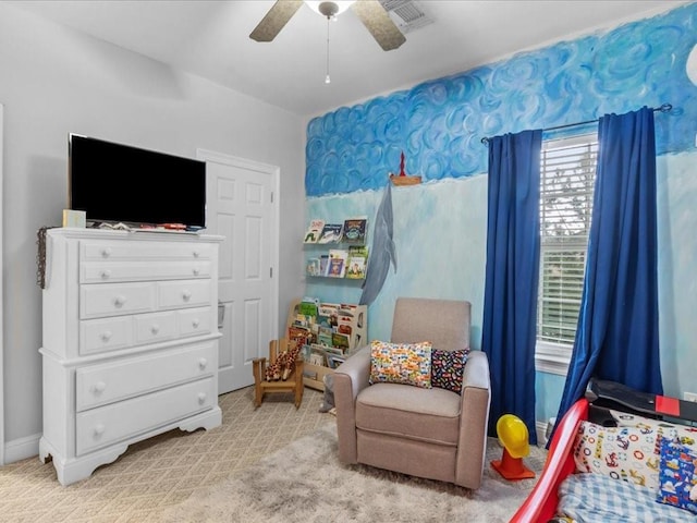 bedroom with light carpet and ceiling fan