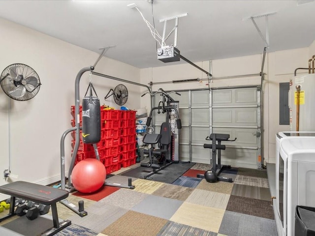 exercise area with washing machine and dryer and water heater