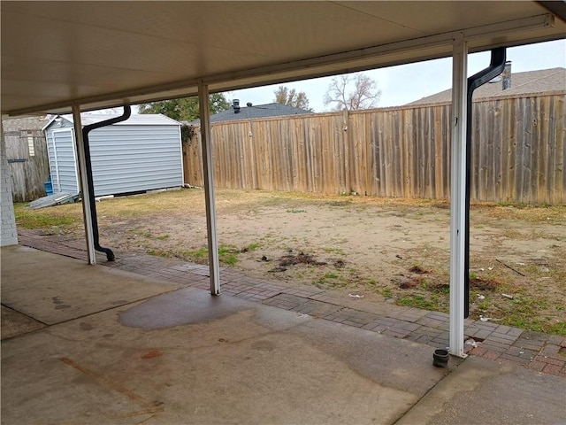 view of patio / terrace with a storage shed