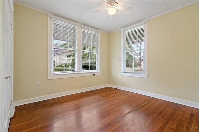 spare room featuring ornamental molding, ceiling fan, and hardwood / wood-style floors