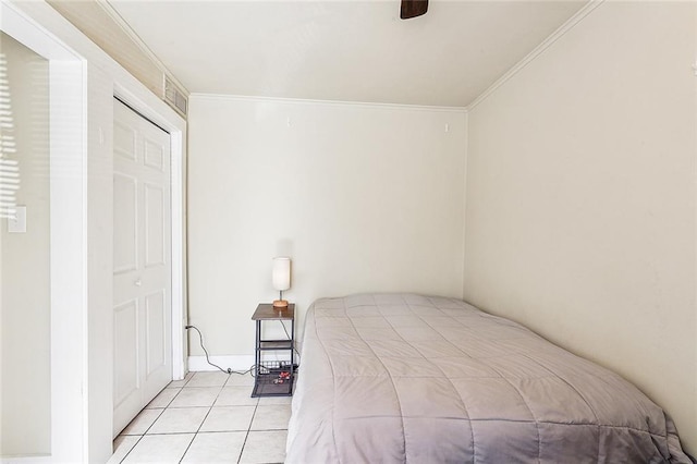 unfurnished bedroom featuring light tile patterned floors, crown molding, and ceiling fan