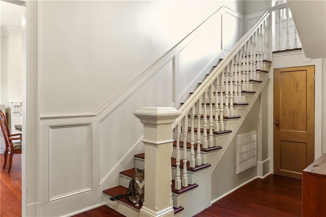 stairway featuring hardwood / wood-style flooring