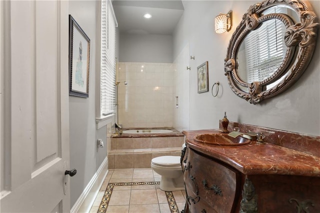 bathroom with plenty of natural light, vanity, tile patterned floors, and toilet