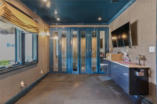 bathroom with crown molding and french doors