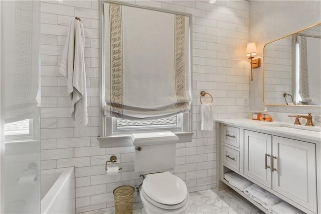 bathroom featuring vanity, tile walls, toilet, and tile patterned floors