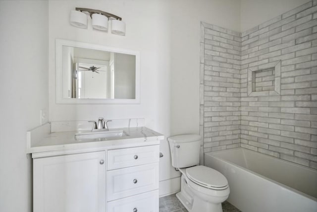 full bathroom featuring vanity, tiled shower / bath, ceiling fan, and toilet