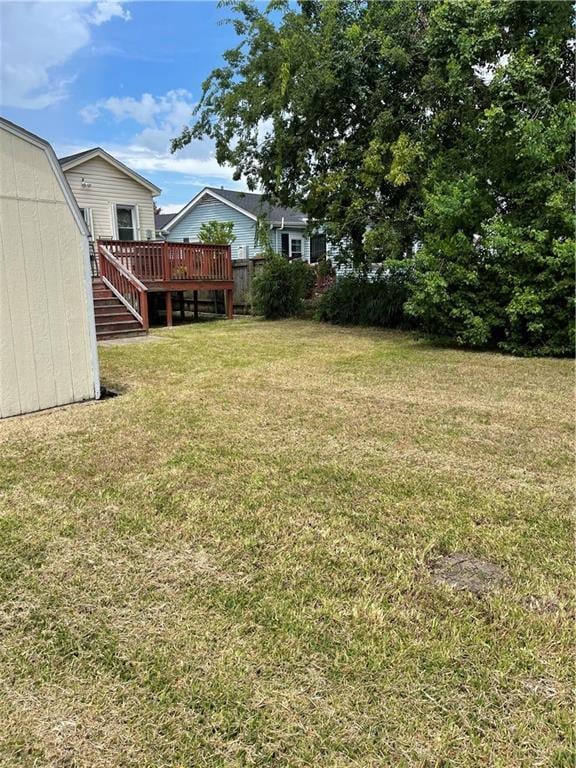 view of yard featuring a wooden deck